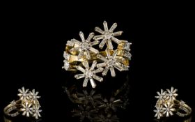 9ct Gold And Diamond Set Ring Comprising four rotating daisy form flowerheads each set with