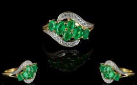 Colombian Emerald Cluster Ring, six oval cut Colombian emeralds set in a sweep across the front of