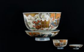 Antique Oriental Tea Bowl And Saucer decorated in under glazed blue depicting flying cranes, gold