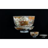 Antique Oriental Tea Bowl And Saucer decorated in under glazed blue depicting flying cranes, gold