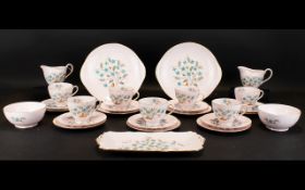 Tuscan Bone China 'Blue Star' Part Tea Service. Comprises 11 Teacups, 12 saucers, 12 small cake/