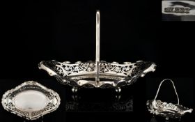 A Nice Quality Solid Silver Swing Handle Fruit Basket with Open worked Sides, Raised on Ball Feet.