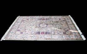 A Large Woven Silk Carpet Keshan rug with Eau De Nil ground and traditional Middle Eastern floral