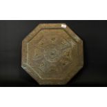 Antique Anglo Indian Plaque Octagonal form floral and scroll embossed brass plaque,