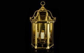 Heavy Brass Wall Lantern complete with glass panels. Decorative lantern in good condition.