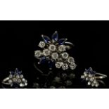 18ct White Gold Flower Head Design Diamond and Sapphire Dress Ring of Very Pleasing Appearance.