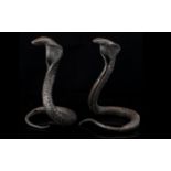 A Pair Of Antique Case Metal Cobras. In Typical Sprayed Hood Form. Height 18cm.