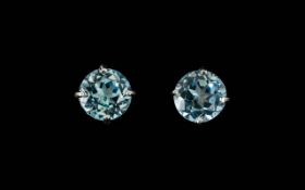 Sky Blue Topaz Solitaire Stud Earrings, each earring having a 2ct round cut sky blue topaz,