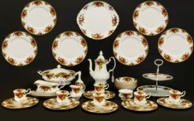 Royal Albert Country Rose Part Dinner/Tea Service to include; Tea Pot, Milk Jug, Sugar Bowl, 6 cups,