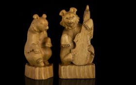 A Pair Of Novelty Carved Bear Figures The first seated with open mouth,