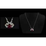 18ct White Gold Ruby And Diamond Pendant Set with large central ruby surrounded by round cut