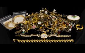 A Mixed Collection Of Costume Jewellery Containing a large collection of gold tone,