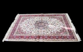 A Large Woven Silk Carpet Keshan rug with beige ground and traditional Middle Eastern floral and