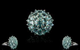 Paraibe Apatite Round Cluster Ring, a domed cluster of 4.25cts of round and oval cut paraibe