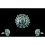 Paraibe Apatite Round Cluster Ring, a domed cluster of 4.25cts of round and oval cut paraibe