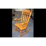 Spindle Back Rocking Chair Open rocking chair with elm seat and turned supports.