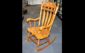 Spindle Back Rocking Chair Open rocking chair with elm seat and turned supports.