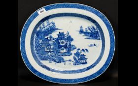 A 19th Century Oriental Oval Charger Large blue and white charger depicting pagodas and