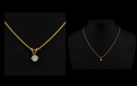 18ct Yellow Gold And Diamond Pendant Necklace Set with a round modern brilliant cut diamond pendant,