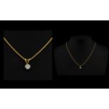 18ct Yellow Gold And Diamond Pendant Necklace Set with a round modern brilliant cut diamond pendant,