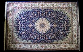 A Very Large Woven Silk Carpet Keshan rug with blue ground and traditional Middle Eastern floral
