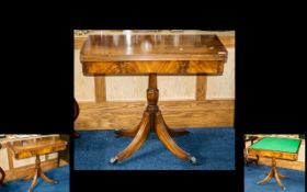 20th Century Mahogany Tilt Top Games Table - raised on turned support with fluted quatrefoil base,