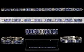 18ct White Gold Superb Emerald Cut Diamond & Tanzanite Link Bracelet. The 16 Emerald Cut Diamonds of