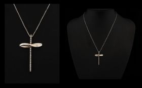 18ct White Gold Diamond Set Cross And Chain Modernist design set with 17 modern brilliant cut