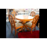 Circular Extending Dining Table And Four Chairs Raised on quatrefoil base,