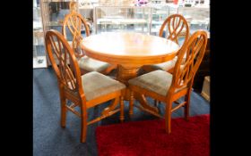 Circular Extending Dining Table And Four Chairs Raised on quatrefoil base,