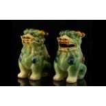 A Pair Sancai Glazed Modern Foo Dogs Each with open mouths in traditional green,