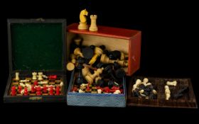 A Collection Of Four Early 20th Century Travelling Chess Sets To include turned bone/cellulose set,
