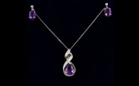 9ct White Gold Diamond And Amethyst Pendant Drop Suspended on a fine link chain.