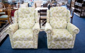 Two Reclining Good Quality Upholstered Armchairs. Cream upholstery with pale green pattern.