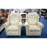 Two Reclining Good Quality Upholstered Armchairs. Cream upholstery with pale green pattern.