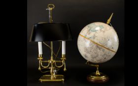 A Replogle 12 Inch Diameter Globe World Classic Series Brass mounts on wooden base.