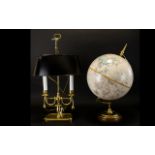 A Replogle 12 Inch Diameter Globe World Classic Series Brass mounts on wooden base.