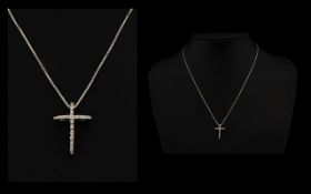 18ct White Gold Diamond Set Cross And Chain Suspended on a fine box link chain,