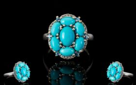 Sleeping Beauty Mine Turquoise Cluster Ring, six oval cut turquoise surrounding a 1ct oval cut,