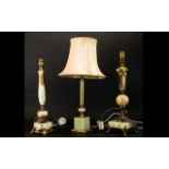 A Collection Of Three Brass And Green Onyx Table Lamps One raised on tripod base,