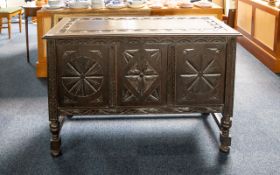 Oak Jacobean Style Bedding Box Comprising carved panel front and top. Raised on turned stretchers.