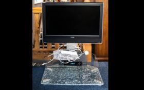 Toshiba Model 32WLT66 Television Complete with glass stand and Sky box.