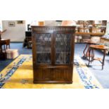 Oak Old Charm Style Display Unit/Bookcase Comprising leaded, glazed front above storage base.