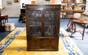 Oak Old Charm Style Display Unit/Bookcase Comprising leaded, glazed front above storage base.