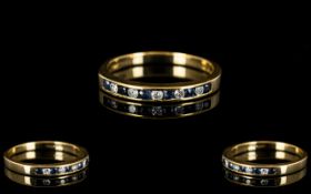 9ct Gold Sapphire And Diamond Eternity Ring Set with alternating round cut sapphires and diamonds,