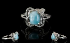 Larimar Solitaire Ring, a cushion cut larimar of 2.5cts set in a decorative milgrain mount with a