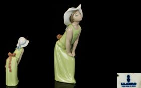 LLadro Figurine In the form of a young girl in bonnet with green dress, height, 9 inches,