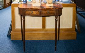 A Pair of Mahogany Console Tables - shaped fronts with two frieze drawers raised on turned,