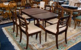 A Late 20th Century Mahogany Extending Table And Six Chairs Of oval form,