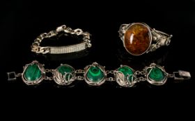 Silver And Malachite Set Bracelet Arts and crafts style statement bracelet comprising five oval